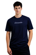 Man wearing a relaxed fit navy blue t-shirt in midnight shade with 'shreads' logo on a white background
This is a tshirt in relaxed fit made of premium cotton 100% with terry texture, made by shreads, shreadslife, shred, shread, shredlife